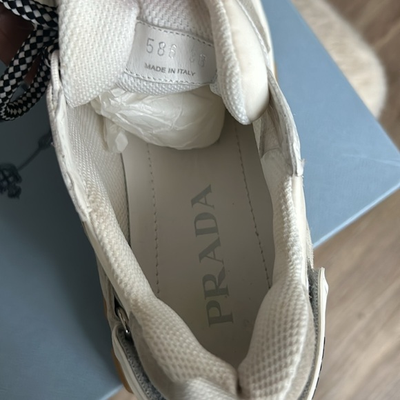 Prada sneakers It has a couple of little spots on it that’s cleanable. - Picture 9 of 12